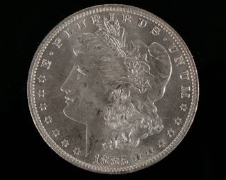 1885-O MORGAN SILVER DOLLAR | Enclosed in an envelope describing it as "borderline MS 65"