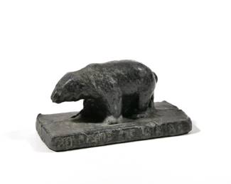 LEAD BEAR PAPERWEIGHT | An unusual handmade bear-form paperweight, "COLLEGE OF MININO"
 - l. 3.25 x w. 1.5 x h. 1.5 in.

