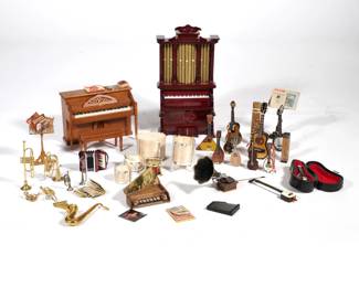 DOLLHOUSE MINIATURE INSTRUMENTS | A collection of miniature instruments and music room accessories, including: a Dave Jone piano top, signed and dated 1981; a Robert Street signed accordion; a banjo signed "LWN" and dated 1983; an upright piano with matching bench [damaged], apparently unsigned; a music box organ, brass flute, wood recorders, a guitar, two mandolins (one in a confirming case), drums, a gilt sheet music stand and a carved openwork wood music stand, brass instruments, sheet music, and more - l. 4.25 x w. 2 x h. 8.25 in. (organ)