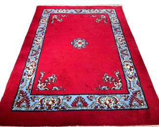 RED VINTAGE MOROCCAN RUG | Deep red color with a cerulean blue inner border. Tag reads "Morocco."
 - l. 106 x w. 74 in.