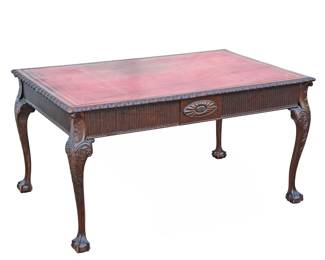 CHIPPENDALE CARVED LEATHER TOP BUREAU PLAT | An impressive carved desk with an inset red leather top with gilt tooling above 2 reeded drawers on ball and claw feet - l. 60 x w. 38 x h. 30 in.
