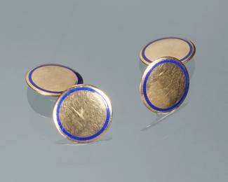 PAIR BLUE ENAMEL & 14K GOLD CUFFLINKS | Designed as polish round gold cufflinks each set with a border of blue enamel; 3/8 in. 9.1g total weight; marked "14"