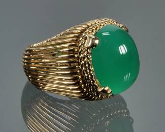 GREEN CHALCEDONY & 18K GOLD RING | Designed as a central oval cabochon (16.1 x 13 x 5.7 mm) prong set within a (tested to) 18k gold wire work ring; size 3.5, 16.4g total weight; no apparent marking.
