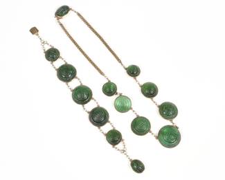 (2pc) CARVED GREEN TOURMALINE, PEARL & GOLD JEWELRY | Probably Chinese, Comprising a necklace having seven round graduated carved green tourmaline links (22.0 - 22.4
 x 11 mm, largest) set in 14k gold separated by chains with seed pearls, and with lengths of 14k gold chain terminating in a carved tourmaline mounted clasp (15.25, 40.4g); and a matching bracelet with five graduated carved tourmaline links (20.4 - 21.5 x 9.3 mm., largest) and a tourmaline mounted clasp (7.25 in., 29.1g) - l. 7 in.