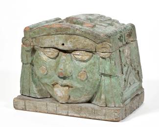 FOLK ART CARVED POLYCHROME BOX | Late 19th/ early 20th century, an unusually heavily carved box with Aztec devices and faces in relief, painted in green over yellow with silver highlights - l. 6.5 x w. 4.5 x h. 5.5 in. (overall)

