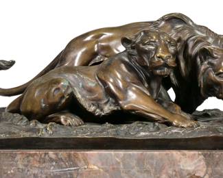 OTTO HOFFMANN (GERMAN, 1885-1915), BRONZE | Lion and lioness, on a marble base - l. 12 x w. 8.25 x h. 7.25 in. 
