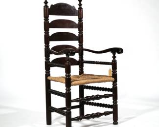 19TH C. BANNISTER BACK CHAIR | Late 19th/ E 20th C. Bannister back armchair, sausage turnings, spindle turnings, contour armrests with hand holds, rush seat - l. 23 x w. 25.75 x h. 50 in.