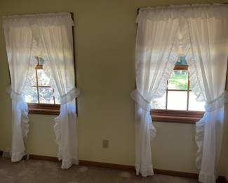 Many Sets of Window Curtains
