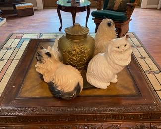 Ceramic cats guarding the holy grail.