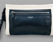 COACH Chic Grey-trimmed Black Leather Bag with Zipper and Tassel
