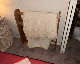quilt rack and bedspread
