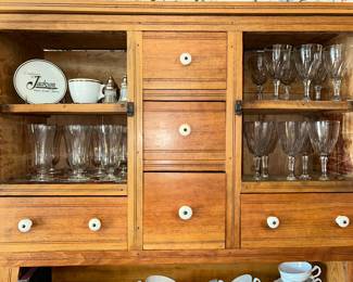 Vintage glassware in a antique bakers rack