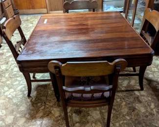#1	Antique wood table with accordion pull out leaves built in and 4 chairs 38-71x42x29	 $275.00 
