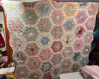 #124	Quilts - BD3	Flower Garden quilt  (as is some holes) Scrappy - 64x80  Hand Quilted, Machine Pieced	 $55.00 			
