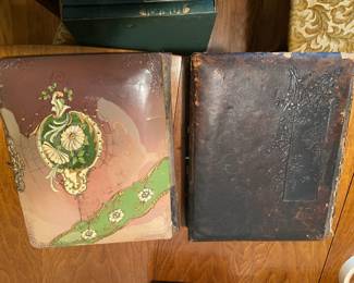 #230	(2) Vintage photo albums of old Photos	 $30.00 			
