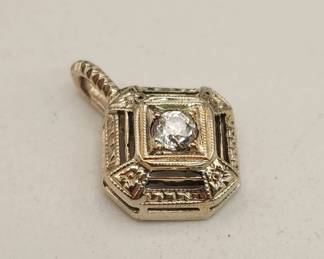 Lot # : 609 - 14k gold and diamond pendant 0.9g total weight
