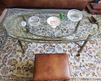 Oval Brass-Beveled Glass Coffee Table on an Indo-Persian Rug