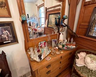 collection of perfume bottles on dresser