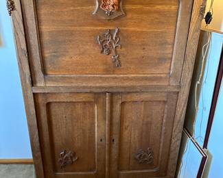 antique European oak cabinet with French accents, top drawer folds down, this is not a secretary!