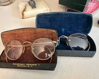 gold field wire framed glasses one with original case and a extra case. 