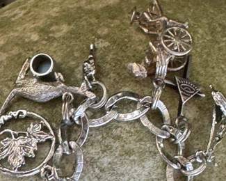 #51 - $100.00 - Sterling charms bracelet 47.51gr - 7"