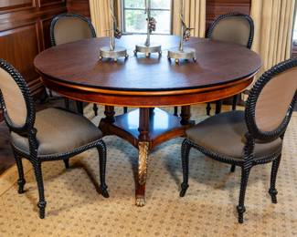 Custom Italian-made mahogany dining table. Six custom-upholstered rope carved wood chairs.