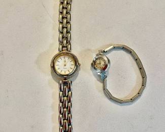 Lot 004a-J: Pair of Vintage Women’s Watches

Features: 
•	Alexander Julian Quartz wristwatch
•	Vintage Elgin 19-jewel wristwatch
o	10K gold-filled 

Condition: 
•	Alexander Julian watch:
o	Very Good cosmetic condition
o	Running condition (new battery?)
•	Elgin watch:
o	Band and case are in Good cosmetic Condition. Face is in poor cosmetic condition (some corrosion spots on the face are evident and the crystal needs to be cleaned.
o	Watch is non-running; stem does not appear to be operable.

Please see photos for additional details.
