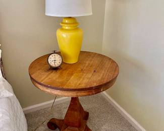 Lot 017-BR2: Round Side Table Vignette

Includes: 
•	Antique solid-wood round side table
•	Yellow porcelain lamp
•	Vintage-style clock

Dimensions:
•	26 ½” D x 29 ½”H
•	Lamp: 24” H (includes shade height)

Condition: 
•	Table is in Fair Pre-Owned Condition; note owner’s installed shim helping keep the base level
•	Lamp and clock are in Good Pre-Owned Condition

