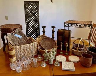 Lot 042-LR: Home Décor 

Features: 
•	Various styled baskets and candlesticks (wood, glass, resin, brass)
•	2 décor tables and a footstool
•	See pictures for details

Dimensions: For reference: The tall décor table is 32”H x 9.5”W x 9.5”D. The little table is 18.5”H x 12.5”W. The footstool stands 16”H. And the matching pair of candlesticks (pictured in the back) are 14.5”H.


Condition: Varies. Please see pictures.

