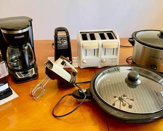 Lot 051-K: Small Kitchen Appliance Assortment

Features: Round electric grill, slow cooker, coffee maker, coffee bean grinder, toaster, can opener and a vintage Sunbeam hand electric mixer


Dimensions: N/A

Condition: All appliances power on.

