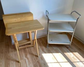 Lot 054-K: Serving It Up (Cart and Trays)

Features: 
•	4 foldable wood trays and one metal cart


Dimensions: Wood trays: 26.5”H x 22”W x 15”D. Metal cart: 30.5”H x 25”W x 15.25”D


Condition: Wood trays have apparent scratch marks (see pics.) The metal cart is solid but has rust along the poles and a large spot on the bottom shelf. See pictures for details.



