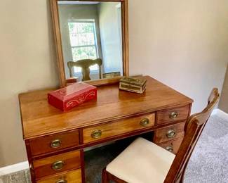 Lot 015-MBR: Desk Vignette

Features: 
•	Vintage solid-wood (Mahogany) desk
•	Mirror from Carolina Mirror Company (“compliments” desk but is not an exact match)
•	Antique chair (seat is not original)
•	2 decorative boxes

Dimensions: 
•	Desk: 45 ½”W x 24”D x 29”H
•	Mirror: 24”W x 38 ¼”H
•	Chair: 17”W x 15 ½”D; 38”H (seat top is 17”H)

Condition: Items are in Good/Fair Pre-Owned Antique Condition. There is a repairable split in the wooden desk. 

