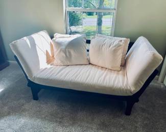 Lot 019-LIB: Futon/Loveseat

Features: 
•	Sturdy, stylish and functional
•	Both ends of the cherry-stained frame can be lowered to allow loveseat to lay flat and be used as a twin bed
•	Pillows and shams/covers are removable and washable

Dimensions (cushion): 80”L x 31”W

Condition: Good pre-owned condition. The cushion/mattress cover has several spots of what appear to be stain or varnish.

