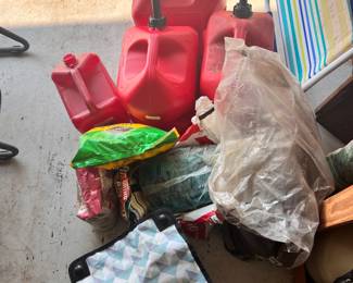 lots of nice gas cans, gas, tools , tool