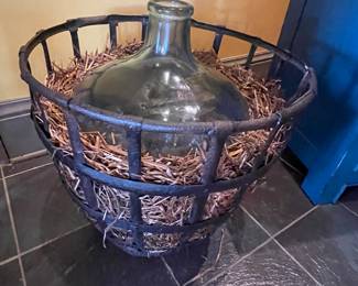 #63 -$150 Wine jug in iron cage 22x19
