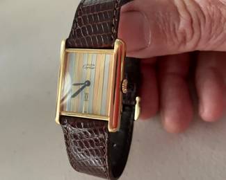 #67J- $1750 - Must de Cartier Paris Men vintage tank 1982 - 925 vermeil colored stripes dial. Manual wind. with original box, authenticity card. Band is original Cartier. Barely worn. 