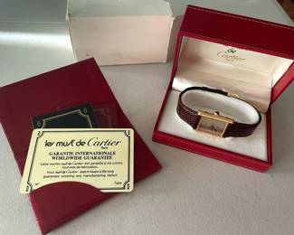 #67J- $1750 - Must de Cartier Paris Men vintage tank 1982 - 925 vermeil colored stripes dial. Manual wind. with original box, authenticity card. Band is original Cartier. Barely worn. 