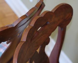 Another closeup of matched set of four vintage wooden chairs