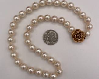 Another view of beautifully matched cultured pearl choker necklace with 14k gold rose form clasp