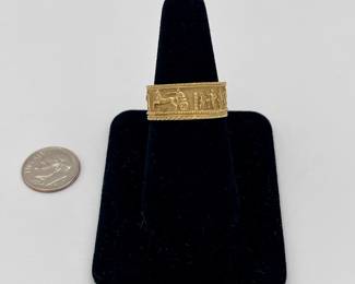 Another view of heavy gold Middle Eastern ring, bas relief figures around the band
