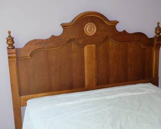 Closeup of carved wooden headboard