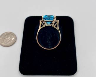 14k gold ring, large topaz, emerald cut, with two diamonds