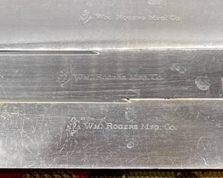 Closeup of blades on Wm. Rogers Mfg. Co. mother of pearl handled sterling collared knives