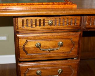 Closeup of vintage 9-drawer wooden desk