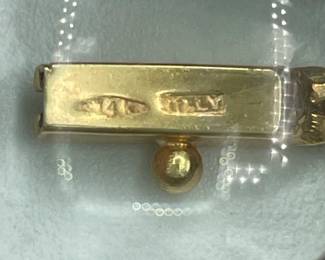Closeup of clasp on 14k gold serpentine link necklace showing the gold stamp and makers mark (Italy?)