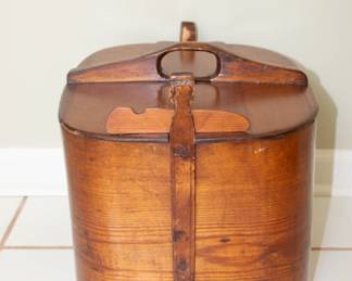 Another view of antique hand-crafted curved wooden lidded basket with handle and side latches