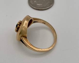 Closeup of 14k gold and sapphire ring