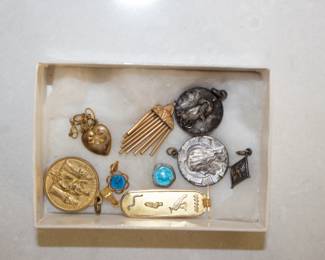 Collection of pendants - religious, Egyptian cartouche, wind chimes; small gold tone locket on slender chain