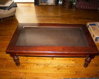 Wooden and glass topped coffee table
