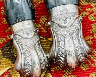 Closeup of antique Victorian era stag horn silver plate collared fish knife and fork